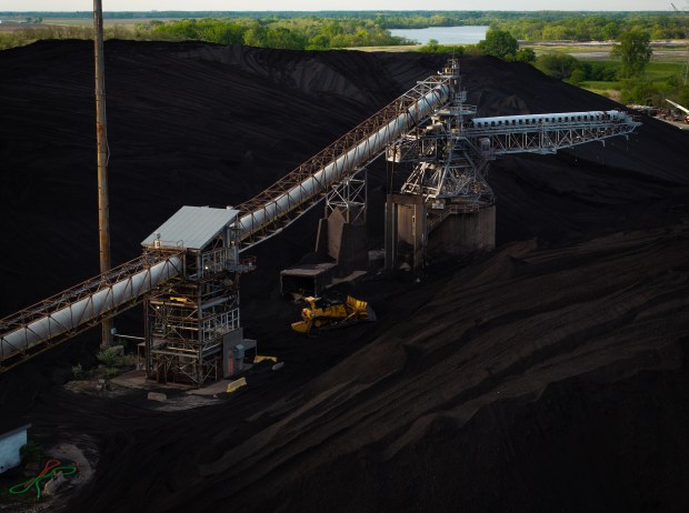 Piles of coal sit outside at Kincaid Generation coal-fired power station in Pawnee on May 8, 2025. (E. Jason Wambsgans/Chicago Tribune)