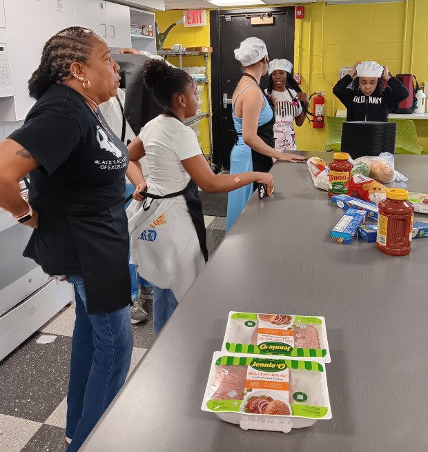 Juanita Black prepares to supervise a culinary arts class with spaghetti, meat sauce and garlic bread on the menu. The students get to enjoy their efforts, and leftovers are taken home to their families. (Gregory Harutunian/For the Lake County News-Sun)