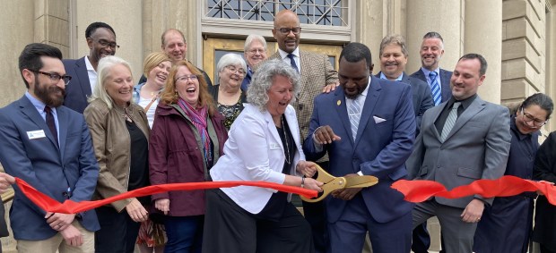 Lori Nerheim cuts the ribbon opening the Waukegan History Museum at the Carnegie. (Steve Sadin/For the Lake County News-Sun)