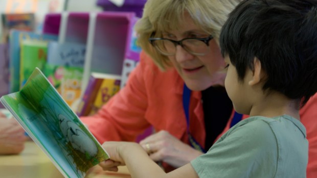 Students benefit from the individualized instruction of volunteer tutors and feel the attention that will aid in raising their literacy rates.(Courtesy of the Reading Power Program)