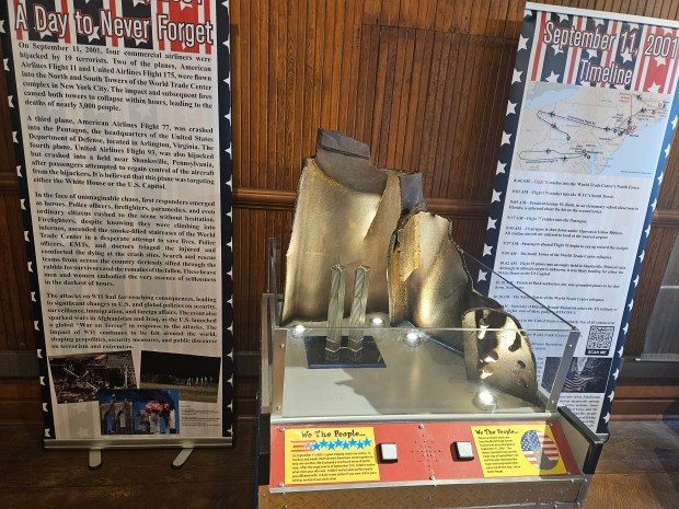 The "America United: The Days After 9/11" exhibit now on display at the Aurora Regional Fire Museum includes pieces of two beams recovered at the World Trade Center site in New York City following the terror attacks on Sept. 11, 2001. (David Sharos / For The Beacon-News)