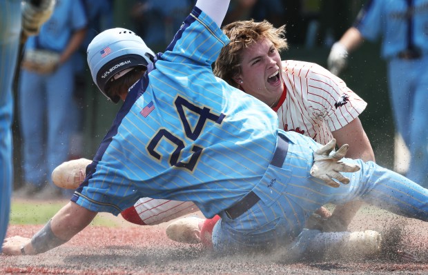 Aurora Christian's Zach Zappia (26) tags Ottawa Marquette's Anthony Couch (24) out at the plate in the fourth inning during the Class 1A Harvest Christian Sectional final at Trout Park in Elgin on Saturday, May 31, 2025.(H. Rick Bamman/for the Beacon-News)