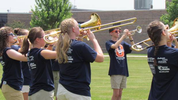 Members of the Oswego High School Marching Band prepare to perform in the PrairieFest parade Sunday in Oswego. (Linda Girardi / For The Beacon-News)