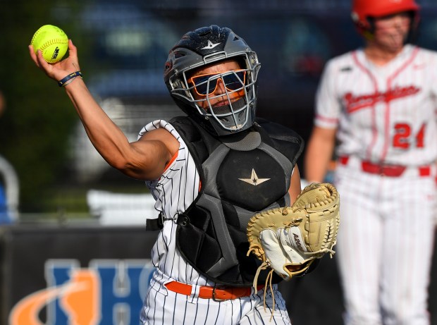 Oswego's catcher Kiyah Chavez (10) picks up a bunt and throws to first. Oswego defeated Barrington 4-1 in the Class 4A championship game at the Louisville Slugger Sports Complex in Peoria, Saturday, June 14, 2025. (Rob Dicker / for the Beacon News)
