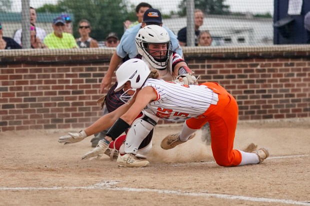 Yorkville's Kayla Kersting (10) tags Oswego's Adalynn Fugitt (5) for an out during a Class 4A Oswego Sectional semifinal game at Oswego High School on Tuesday, June 3, 2025. (Sean King / for The Beacon-News)