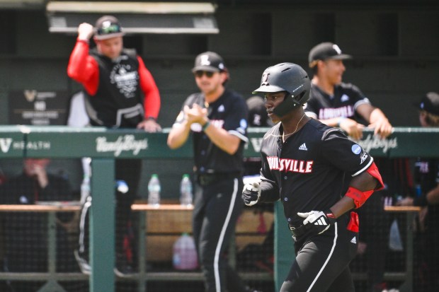 Louisville's Eddie King Jr. is celebrated by the bench after hitting a home run against ETSU on May 30, 2025, in Nashville, Tenn. (AP Photo/John Amis)