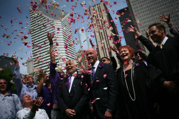 José "Pepe" Pena, left, and Arthur Johnston, a couple for 38 years, celebrate after being joined in a civil union in Wrigley Square at Millennium Park, on June 2, 2011. (E. Jason Wambsgans/ Chicago Tribune)