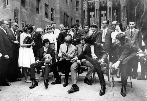 The Rolling Stones at a June 1964 press conference in front of Tribune Tower in Chicago saw Bill Wyman, from left, Brian Jones, Charlie Watts, Keith Richards and Mick Jagger slouching in their folding chairs. (Chicago Tribune historical photo)