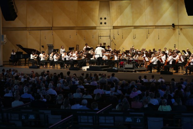 The audience listens as the Chicago Symphony Orchestra performs during its residency at Ravinia Festival in Highland Park on July 13, 2024. (Trent Sprague/for the Chicago Tribune)