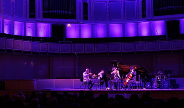 In a recent MusicNOW series concert, violinist Daniel Bernard Roumain, left, performs with members of the Chicago Symphony Orchestra at Symphony Center on Nov. 24, 2024, in Chicago. (Armando L. Sanchez/Chicago Tribune)
