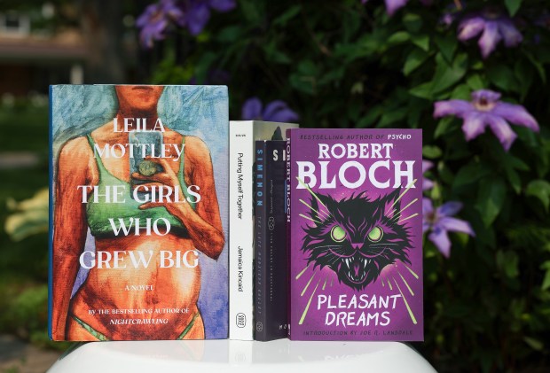 "The Girls Who Grew Big" by Leila Mottley, "Putting Myself Together" by Jamaica Kincaid, "The Late Monsieur Gallet" by Georges Simenon and "Pleasant Dreams" by Robert Bloch, photographed in Barrington. (Stacey Wescott/Chicago Tribune)