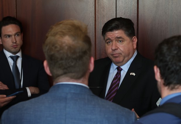 Gov. JB Pritzker answers reporters' questions about the state budget after attending the Jim Edgar Reading Room Dedication at the Illinois State Library on May 28, 2025, in Springfield. (John J. Kim/Chicago Tribune)