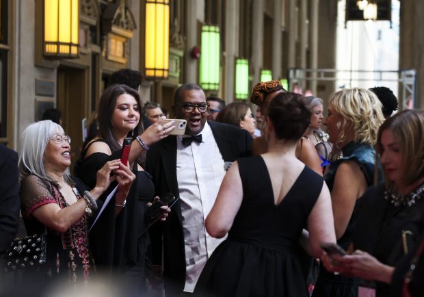 People take photos as they arrive at the red carpet while attending the James Beard Foundation Awards at the Lyric Opera of Chicago on June 10, 2024. (Eileen T. Meslar/Chicago Tribune)