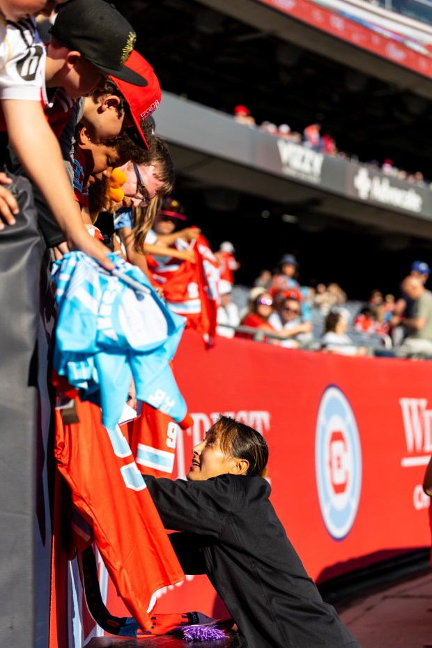 Manaka Hayashi of the Stars signs jerseys after a game against the Seattle Reign on Saturday, June 14, 2025, at Solder Field. (Vincent D. Johnson/for the Chicago Tribune)