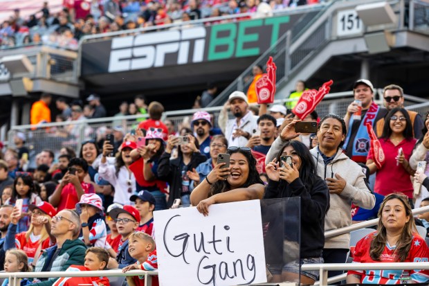 Fire fans stand and cheer as on-field festivities start before a game against Nashville on Saturday, June 14, 2025, at Solder Field. (Vincent D. Johnson/for the Chicago Tribune)