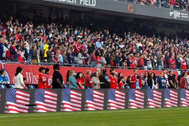 The Fire stand during the national anthem Saturday, June 14, 2025, at Solder Field. (Vincent D. Johnson/for the Chicago Tribune)