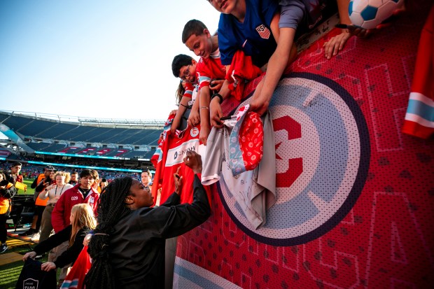 The Stars' Ludmila signs jerseys after a game against the Seattle Reign, part of a doubleheader with the Fire on Saturday, June 14, 2025, at Solder Field. (Vincent D. Johnson/for the Chicago Tribune)