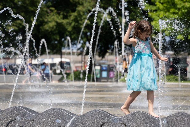 Elanor Markwell, 6, plays at Polk Bros Park near Navy Pier's entrance, June 6, 2025. Markwell was visiting from Portland, Oregon. (Audrey Richardson/Chicago Tribune)