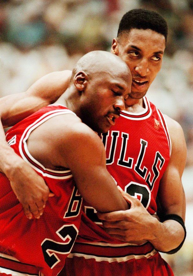 The Chicago Bulls' Scottie Pippen assists teammate Michael Jordan off the court for a timeout in Game 5 of the NBA Finals on June 11, 1997, in Salt Lake City. Jordan apparently ate bad room service food and went on to play in a weakened condition. (Nuccio DiNuzzo/Chicago Tribune)