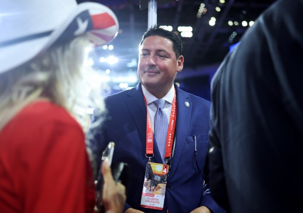 State Rep. John Cabello talks with a Texas delegate at the start of Thursday's Republican National Convention session at Fiserv Forum on July 18, 2024, in Milwaukee. (John J. Kim/Chicago Tribune)