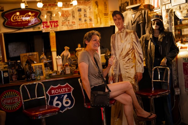 French tourist Murielle Fressancourt poses for a photo in the Hackberry General Store on Route 66 in Hackberry, Arizona, June 6, 2025. (E. Jason Wambsgans/Chicago Tribune)