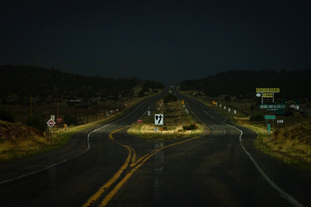 The sky darkens during a rainstorm on Route 66 near Seligman, Arizona, June 6, 2025. (E. Jason Wambsgans/Chicago Tribune)
