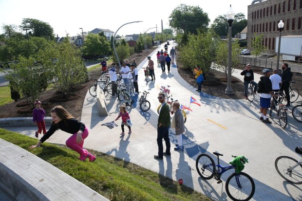 People gather at the Western Avenue entrance to The 606 trail in preparation for the official opening of the outdoor space on June 6, 2015. (Nancy Stone/Chicago Tribune)