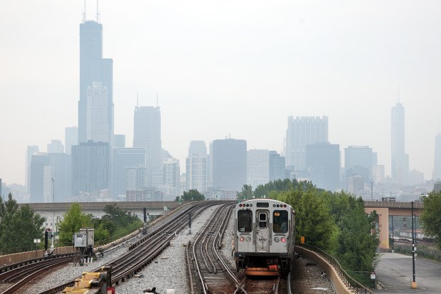 A Chicago Transit Authority Red Line train heads north toward downtown Chicago as the region is shrouded in a haze on June 4, 2025. (Terrence Antonio James/Chicago Tribune)
