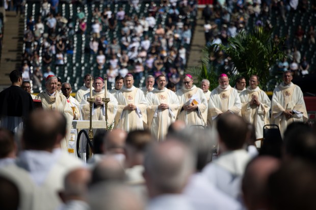 Cardinal Blase Cupich leads the beginning of a Catholic Mass begins while celebrating the election of Pope Leo XIV with a citywide gathering at Rate Field in Chicago on June 14, 2025. (Audrey Richardson/Chicago Tribune)
