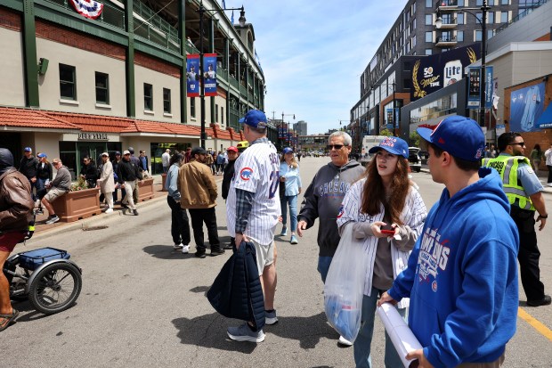 People arrive on Addison Street outside of Wrigley Field in Chicago for a game between the Cubs and the Colorado Rockies on May 26, 2025. (Chris Sweda/Chicago Tribune)