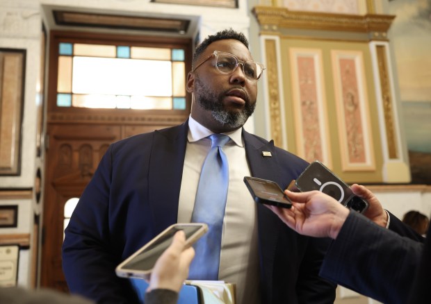 State Rep. Kam Buckner answers reporters' questions outside a House hearing room during a caucus at the Illinois State Capitol on May 29, 2025, in Springfield. (John J. Kim/Chicago Tribune)