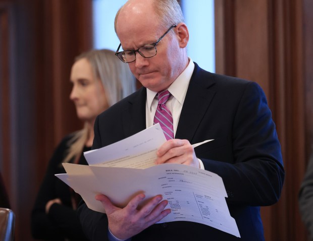 Senate President Don Harmon looks over the paperwork of a House bill during debates on the Senate floor at the Illinois Capitol building on May 29, 2025, in Springfield. (John J. Kim/Chicago Tribune)