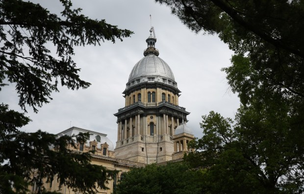 Spring foliage partially frames the Illinois State Capitol on May 30, 2025, in Springfield. Illinois legislators passed a number of bills in the last days of the General Assembly's spring session. (John J. Kim/Chicago Tribune)