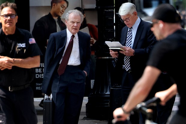 Former Speaker Michael Madigan, second from left, waits to cross Jackson Boulevard with attorney Thomas Breen as they arrive at the Dirksen U.S. Courthouse for a hearing on sentencing guidelines on June 10, 2025. (Antonio Perez/Chicago Tribune)