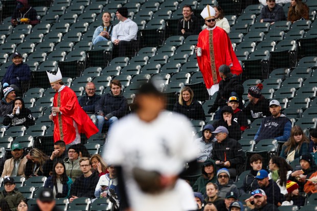 Fans dressed as Pope Leo XIV walk through the stands while the White Sox play the Mariners at Rate Field, May 19, 2025, in Chicago. (Armando L. Sanchez/Chicago Tribune)
