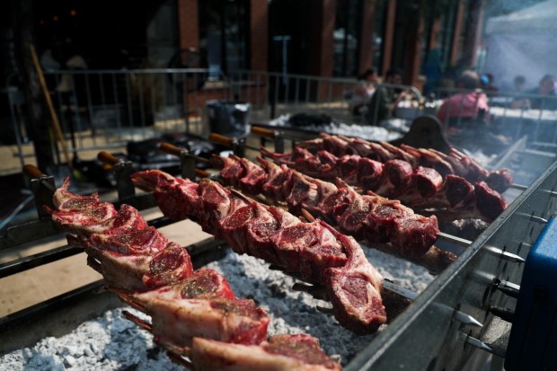 Lamb chops cook at the Spectrum Bar & Grill tent during Taste of Greektown in Chicago on Sept. 8, 2024. (Eileen T. Meslar/Chicago Tribune)