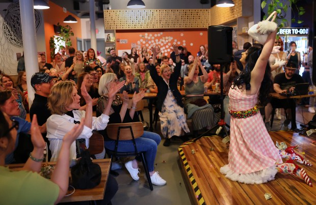 The audience reacts as Amanduh Frost finishes a performance as part of a True Colors drag show at Sketchbook Brewing in Evanston, May 31, 2025. (Chris Sweda/Chicago Tribune)