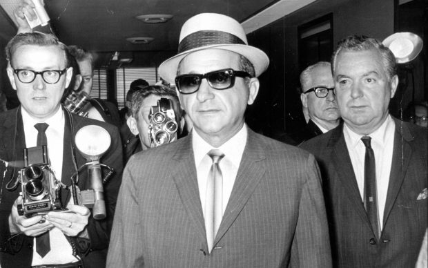 Sam "Momo" Giancana leaves the courtroom in the Federal Building before being jailed for contempt of court on June 1, 1965.