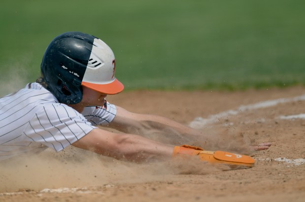 Libertyville's Cole Lockwood slides into home