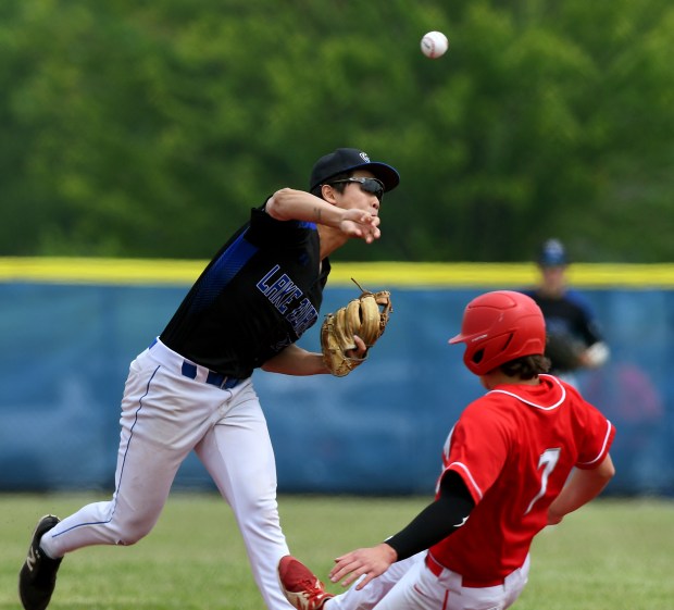 Lake Zurich second baseman Colin Chung tries to turn a double play