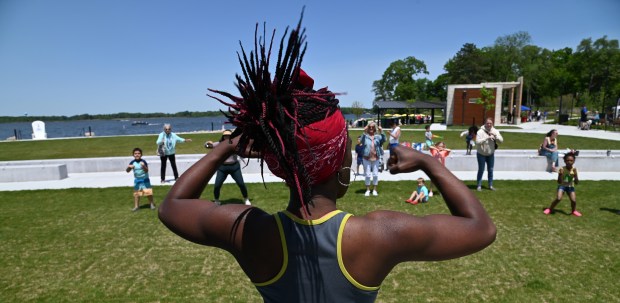 Bennie Conyers of the Fox Lake Ingleside area leads a Zumba session on the lawn in view of the shoreline and beach at the Grand Opening Beach Party and Bike Rodeo on May 31, 2025 at Lakefront Park in Fox Lake. (Karie Angell Luc/Lake County News-Sun)