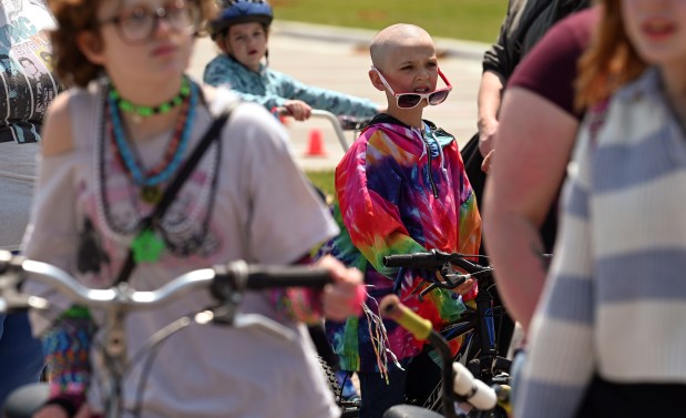 With sunglasses temporarily down is cyclist Piper Hoeft, 9, a rising fourth-grader from Fox Lake at the Grand Opening Beach Party and Bike Rodeo on May 31, 2025 at Lakefront Park in Fox Lake. (Karie Angell Luc/Lake County News-Sun)