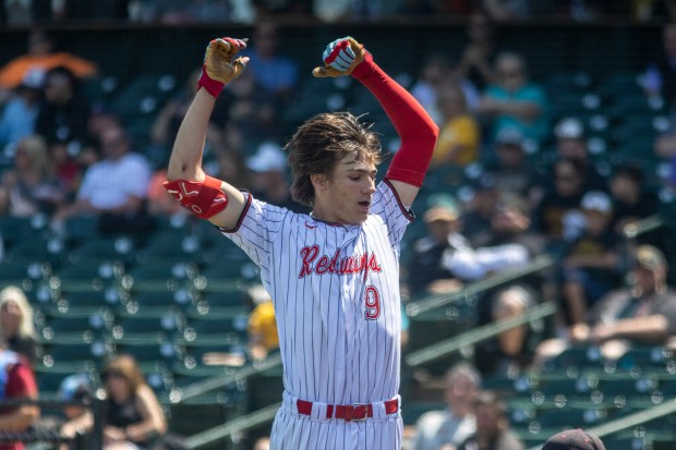 Benet's Quinn Rooney celebrates after hitting a home run