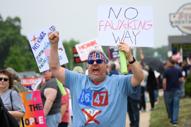 Dyer resident David Hilt leads fellow protesters in a chant during the "No Kings" rally in Highland on Saturday, June 14, 2025. (Kyle Telechan/for the Post-Tribune)