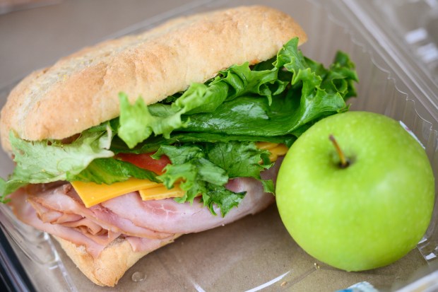 A packed meal sits ready to be eaten during a summer meals program at Twin Oaks Park in New Chicago on Thursday, June 12, 2025. (Kyle Telechan/for the Post-Tribune)