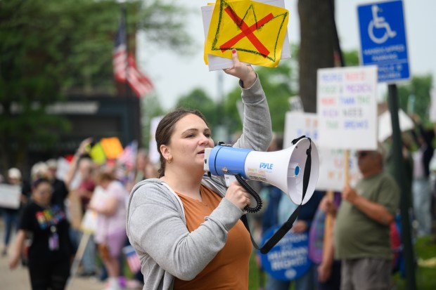 Molly Rabe, who volunteers with NWI Activists and Nasty Women of Porter County, leads a chant during the NWI Activists "Ban Fascists Not Books" event in downtown Valparaiso on Friday, June 13, 2025. (Kyle Telechan/for the Post-Tribune)