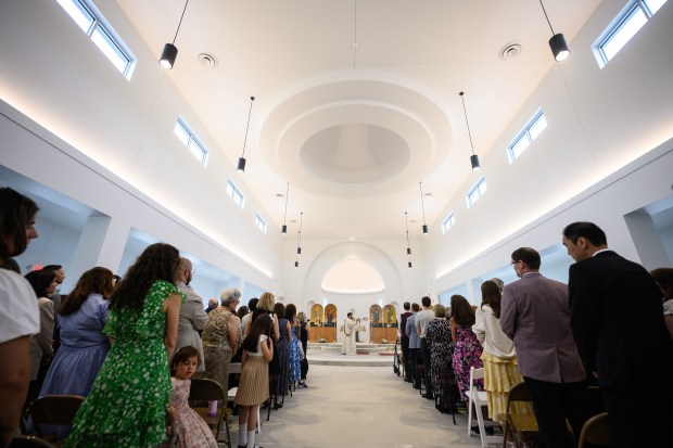 St. Iakovos Greek Orthodox Church clergy and congregants gather in the newly-opened sanctuary on Saturday, June 14, 2025. (Kyle Telechan/for the Post-Tribune)