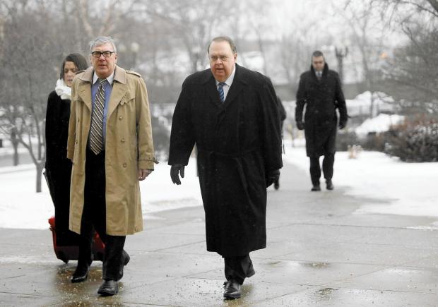 Former Lake County Sheriff John Buncich, right, walks to the Federal courthouse in Hammond with his then-attorney Bryan Truitt for his sentencing on Jan. 16, 2018. (Suzanne Tennant / Post-Tribune)