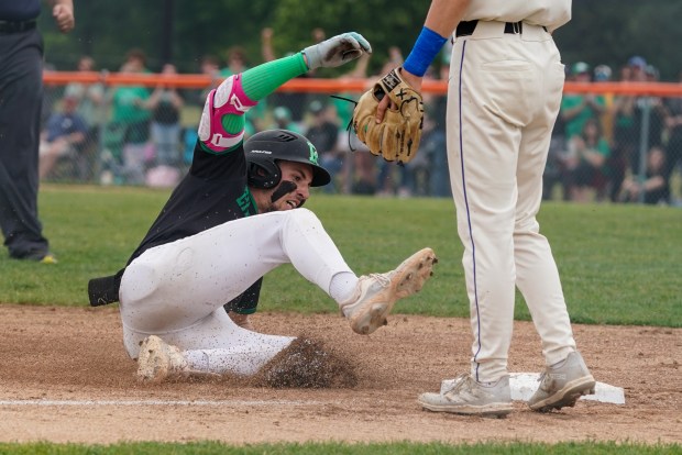 Providence's Cooper Eggert (3) slides into third base off of a three-run triple against Lincoln-Way East during a Lincoln-Way West Class 4A Sectional final game at Lincoln-Way West High School in New Lenox on Saturday, June 7, 2025. (Sean King / for The Daily Southtown)