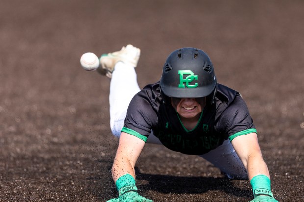 Providence's Blake Jenner (23) slides into third for a triple as the throw comes in from the outfield during the Class 4A Sandburg Regional final against Homewood-Flossmoor at Andrew in Tinley Park on Saturday, May 31, 2025. (Vincent D. Johnson / for the Daily Southtown)